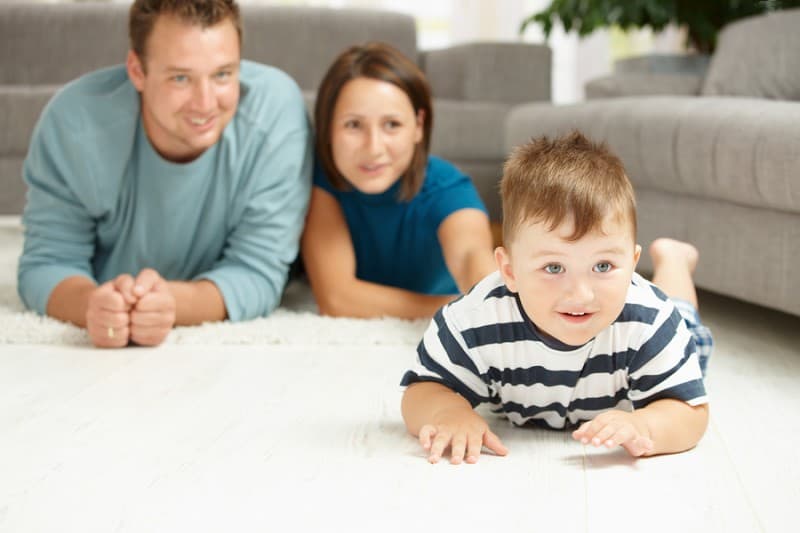 bigstock-Happy-family-lying-on-floor-in-13094744-800x533